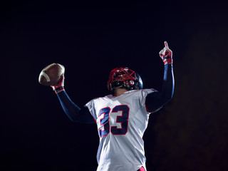 Fototapeta na wymiar american football player celebrating after scoring a touchdown