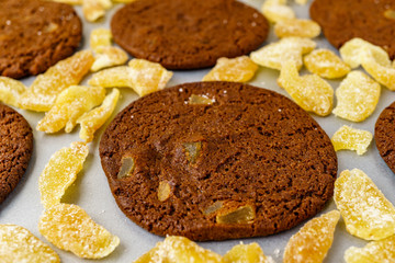 Freshly baked chocolate ginger snap cookies on the baking sheet on a table close-up.