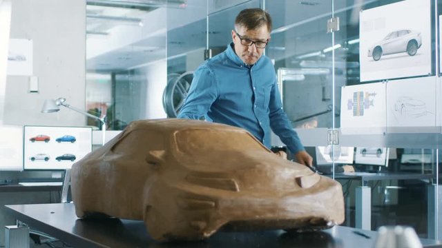 Experience Automotive Designer with a Rake Sculpts Prototype Car Model from Plasticine Clay.  Shot on RED EPIC-W 8K Helium Cinema Camera.