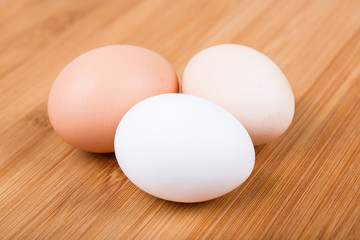Farm fresh eggs on a wood background