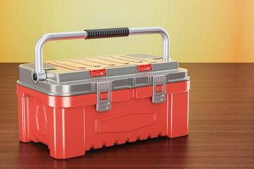 Red toolbox on the wooden table, 3D rendering