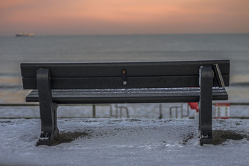 Sunset on the beach in snowy day