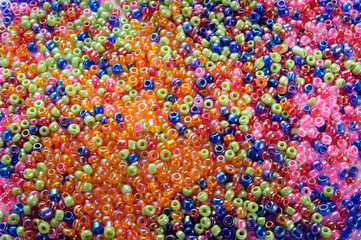 Texture made with colorful small glass balls with holes