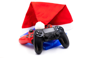 video game controllers and CDs isolated with santa hat