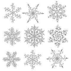 Set of hand-drawn black-and-white snowflake 