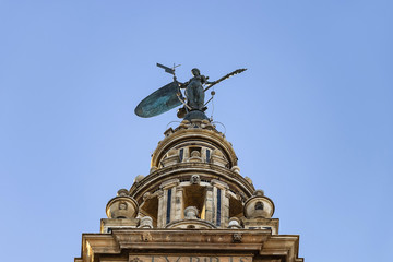 Fototapeta na wymiar Statue of Giraldillo in the top of the Giralda tower in Seville