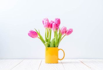 pink tulip flower on wood background