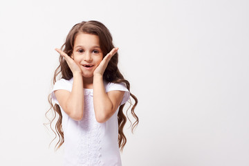 Wonder. Beautiful little girl. White background