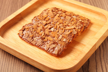 Chocolate crunch on wooden plate