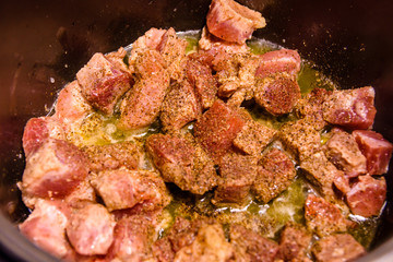Pork meat preparing in a slow cooker
