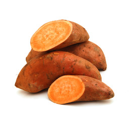 whole and halved sweet potatoes isolated on white