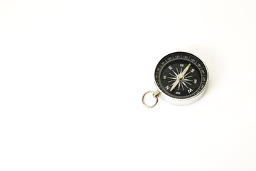 Compass pointing north on white
