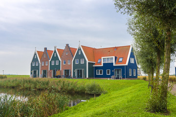 Fototapeta na wymiar Volendam is a town in North Holland in the Netherlands. Colored houses of marine park in Volendam. North Holland, Netherlands..