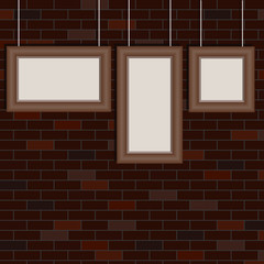 The frames for the pictures hang on the background of the brick wall. Retro frames for pictures.