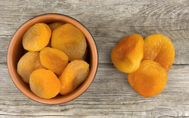 Delicious dried apricots in a bowl, food