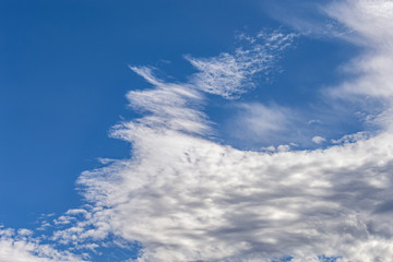 background of a blue sky with a white clouds