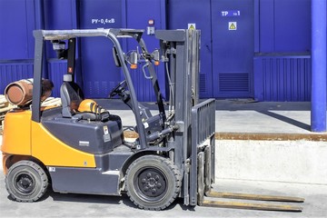 Forklift trucks for moving goods in warehouses.