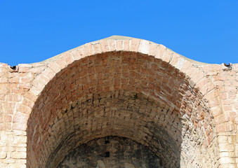 Fototapeta na wymiar Detail of an ancient Arcade in bricks
