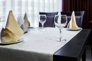 Closeup of empty wine glasses on banquet table in restaurant