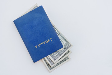Dollars in the blue passport on a white background, close-up
