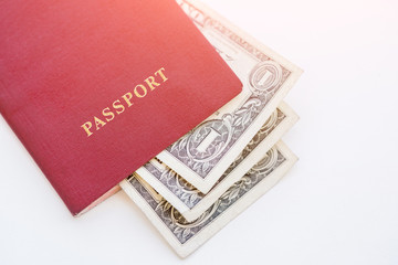 Dollars in the red passport on a white background, close-up