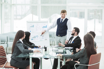  business team gives a presentation of a new financial project for the business partners of the company