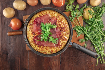 Spanish tortilla with ingredients and copy space