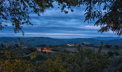 Panoramic view of scenic Tuscany landscape with rolling hills and valleys in beautiful moonlight at dawn