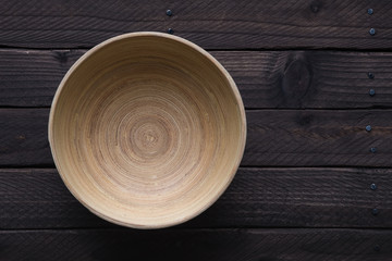 Wooden bowl on a wooden table