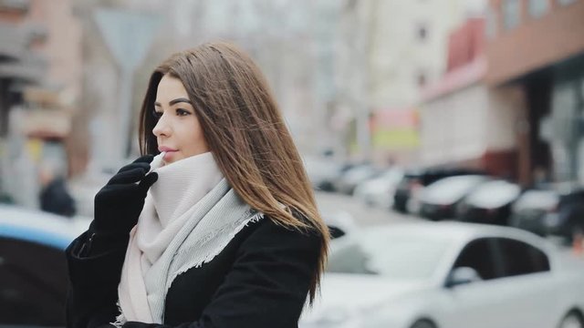 Woman smoking electronic sigarette in frost winter city