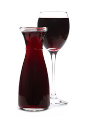 Glass and bottle of red wine, isolated on white background