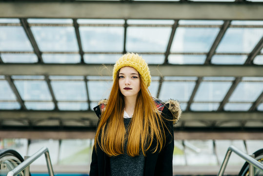 Young pretty woman standing in mall