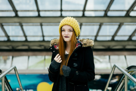 Young pretty woman standing in mall