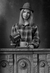 Beautiful  woman pours coffee into the cup .