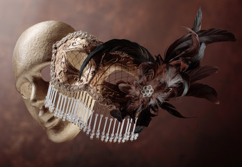 Two golden carnival masks .