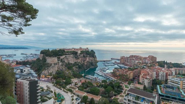 Sunrise in Monaco: zoom in view on port Fontvieille and Rock of Monaco with old town - time lapse video
