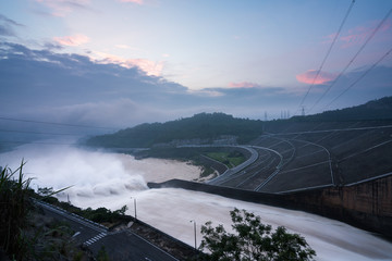 Smooth draining water from the hydroelectric dam at dawn