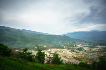Fototapeta na wymiar Terraced rice field in water season, the time before starting grow rice in Y Ty, Lao Cai province, Vietnam