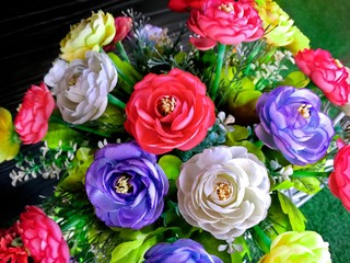 Fototapeta na wymiar Vivid Colorful Fabric Flowers in the Pot
