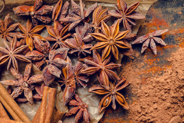 Anise stars on the rustic wooden background. Selective focus. Shallow depth of field.