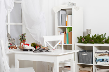 white room interior with christmas decoration, window, table and chair
