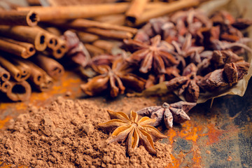 Cinnamon sticks on the rustic wooden background. Selective focus. Shallow depth of field.