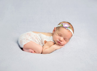 Adorable newborn baby in bodysuit