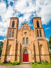 Fototapeta premium Facade And Front Door Of An Old Catholic Church in summer