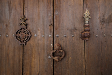 Old wooden door with door knocker