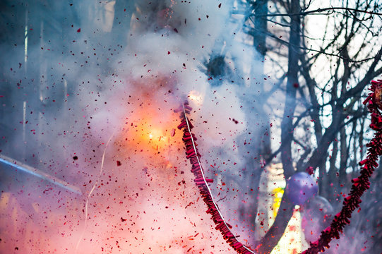 Firecrackers exploding in the street for the chinese new year celebration