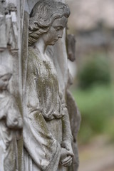 Fototapeta na wymiar Wheathered angel on a tomb