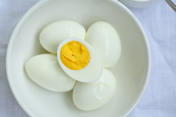 Boiled eggs in bowl above