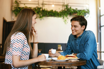 Couple With Coffee On Date. Beautiful Smiling People