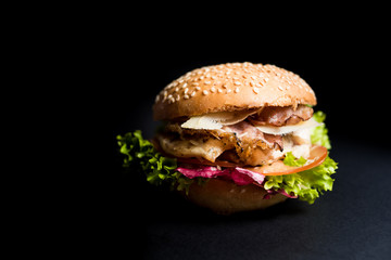 Burger with leaves of lettuce and meat